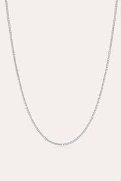 The Alba Tennis Necklace in Silver is displayed against a plain white background, highlighting its delicate and understated elegance.