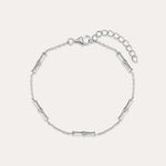 The Bamboo Chain Bracelet in Silver features small, evenly spaced cylindrical accents on a fine S925 sterling silver chain with a lobster clasp and adjustable extension. Displayed against a plain, light background.