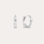 The Colette Droop Link Huggie Earrings in Silver are shown against a white background, with one earring facing front and the other from the side to display their sleek, polished, and minimalist design—ideal for everyday wear.