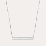 The Regina Horizontal Bar Pendant Necklace in Silver features a minimalist silver bar with a single, sparkling cubic zirconia at its center—ideal for lovers of simple, elegant jewelry.