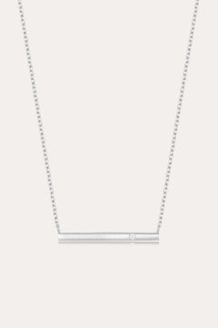 The Regina Horizontal Bar Pendant Necklace in Silver features a minimalist silver bar with a single, sparkling cubic zirconia at its center—ideal for lovers of simple, elegant jewelry.