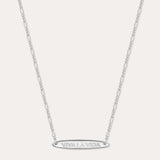 The Viva La Vida Bar Chain Necklace in Silver features a delicate, adjustable Figaro chain and an engraved oval horizontal bar pendant with VIVA LA VIDA in capitals, shown on a plain white background.
