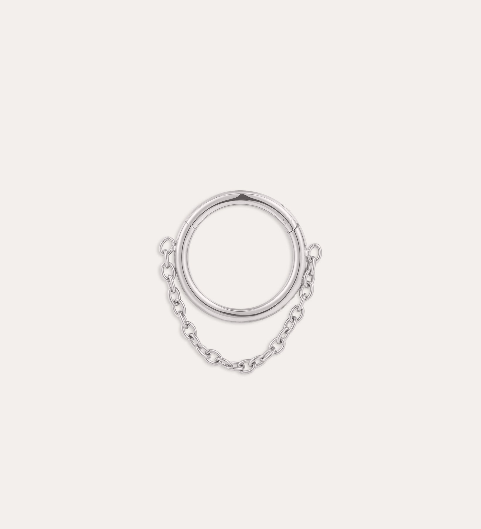 The Chain Clicker Titanium Ring in Platinum, featuring a platinum PVD hoop linked to a delicate chain, is elegantly showcased against a plain white background.