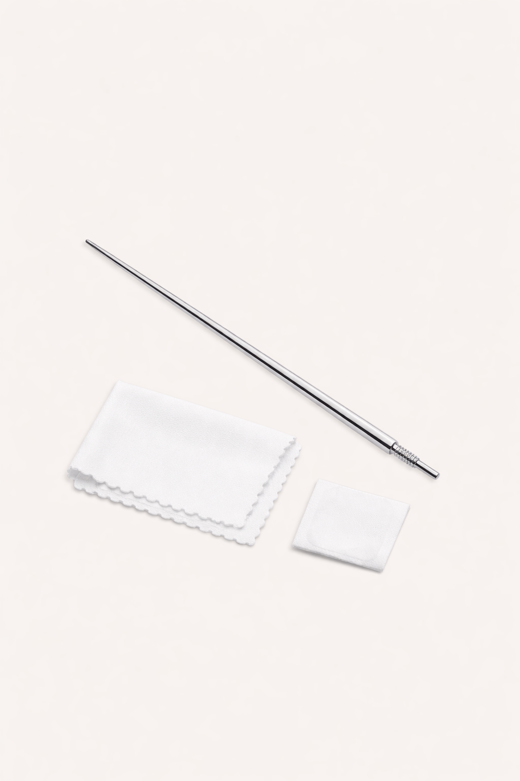 The Vanchi Labret Piercing Taper Care Set, featuring a metal taper with textured grip, is shown above a folded white cloth and small square pad on a light surface.