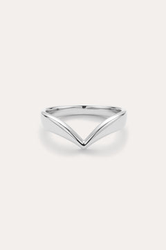 The Veda Plain Chevron Ring in Silver features a minimalist, V-shaped sterling silver design, showcased against a simple light background.