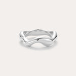 The Vica Fluid Wave Chunky Band Ring in Silver, featuring a smooth, wavy design, is displayed against a plain light background.