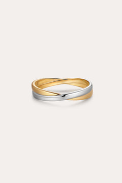 The Yvette Two-Tone Mixed Metal Ring features intertwined bands of gold and silver, showcased against a plain, light background.